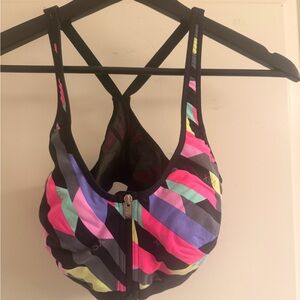 VSX Black Front-Zip Sports Bra with Neon Pink Purple Aqua and Yellow Stripes